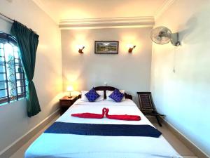 Postel nebo postele na pokoji v ubytování Golden Papaya Guesthouse