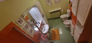 a small bathroom with two toilets and a sink at Villa "CENTRAL VILLAGE" in Županja +37 photos