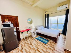 Voodi või voodid majutusasutuse Aizawl Guest House Apartments toas