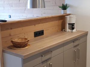 a kitchen counter with a coffee maker and a basket on it at Appartement rénové 2 pièces cabine avec balcon - 6 personnes - Wifi inclus - FR-1-346-558 in Arc 1800
