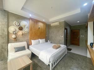 Letto o letti in una camera di Check-in Resort Koh Larn
