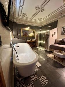 a bathroom with a toilet and a sink in a room at Riad Al Nubala in Marrakesh +106 photos