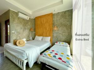 Letto o letti in una camera di Check-in Resort Koh Larn