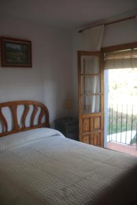 Postel nebo postele na pokoji v ubytování HOSTAL MONCADA