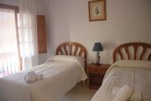 Postel nebo postele na pokoji v ubytování HOSTAL MONCADA