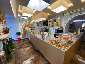 a bakery with a counter with pastries on it at Portercole B&B in Tropea
