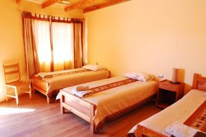 Postel nebo postele na pokoji v ubytování Quechua Hotel