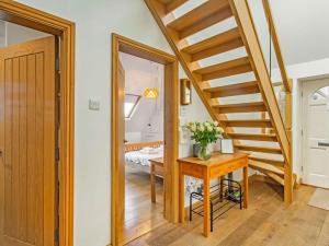 a hallway with a stairway leading to a bedroom at 2 bed in Harrogate 87817 in Harrogate