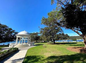 a gazebo in a park next to the water at NY Special Granny Flat in Mosman in Sydney