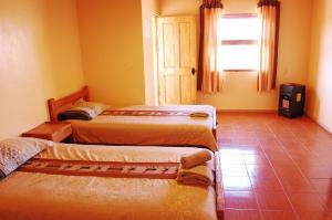 Postel nebo postele na pokoji v ubytování Quechua Hotel