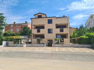 a building on the side of a street at Villa Patricija-apartmani in Poreč