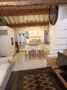 a living room with a couch and a table and chairs at Il bosco sul Tevere Guest house in Perugia +41 photos