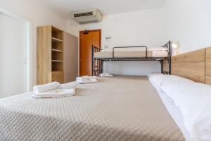 Postel nebo postele na pokoji v ubytování Hotel Luana