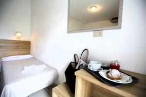 Postel nebo postele na pokoji v ubytování Hotel Luana