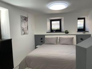 Postel nebo postele na pokoji v ubytování Apartment Aria