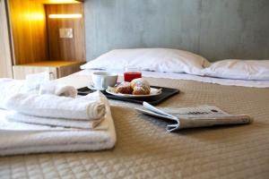Postel nebo postele na pokoji v ubytování Hotel Luana