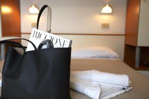 Postel nebo postele na pokoji v ubytování Hotel Luana
