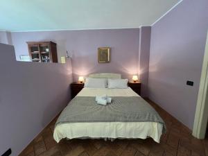 Posteľ alebo postele v izbe v ubytovaní Le Serre Suites & Apartments