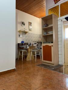 a kitchen and dining room with a table and chairs at Red Locomotive Apartment in Budapest