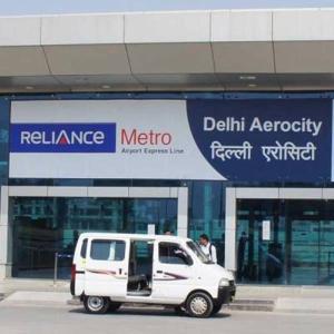 a white van parked in front of a store at Hotel Aerocity Golden Near IgI New Delhi Airport in New Delhi