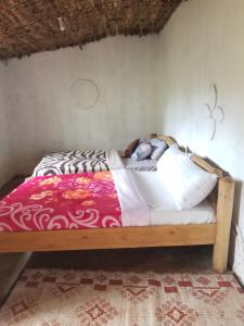 מיטה או מיטות בחדר ב-Rock garden Sipi
