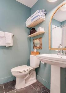 a bathroom with a toilet and a sink at Luxury StillWaters Lake Martin Townhouse in Dadeville
