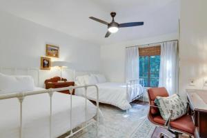 a bedroom with two beds and a ceiling fan at Luxury StillWaters Lake Martin Townhouse in Dadeville