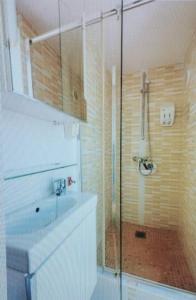 a bathroom with a shower with a glass door at Casa Salida del Sol in Charco del Palo +16 photos