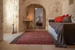 Ένα ή περισσότερα κρεβάτια σε δωμάτιο στο Trulli Petralma +31 φωτογραφίες