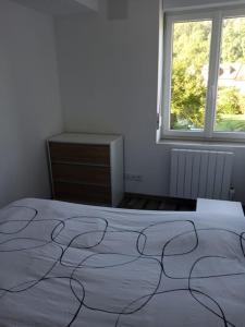 Ένα ή περισσότερα κρεβάτια σε δωμάτιο στο location maison vacance