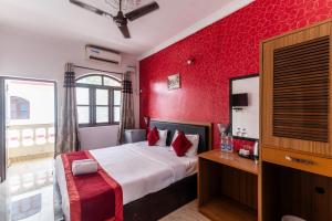 Ένα ή περισσότερα κρεβάτια σε δωμάτιο στο De Alara Calangute +4 φωτογραφίες