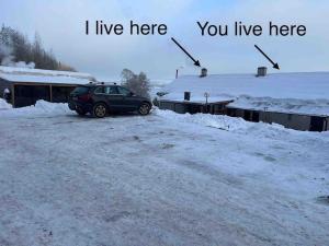 a car parked in the snow with the words i live here you live at Sea view Holmestrand sauna and hot tube appartment in Holmestrand