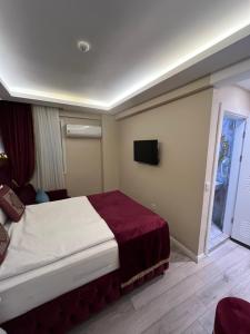 Postel nebo postele na pokoji v ubytování Constantinopolis Hotel