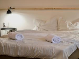 Postel nebo postele na pokoji v ubytování Forty40 Residence