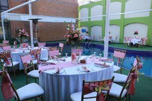a table set up for a party in a pool at Ramada by Wyndham Multan in Multan