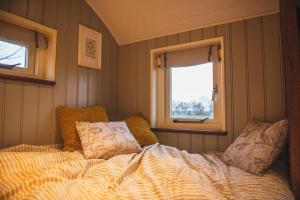 Ein Bett oder Betten in einem Zimmer der Unterkunft Unieke, luxe herdershut