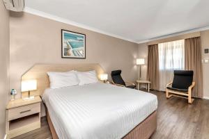 Postel nebo postele na pokoji v ubytování Quality Inn Railway Motel