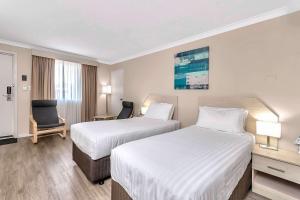 Postel nebo postele na pokoji v ubytování Quality Inn Railway Motel