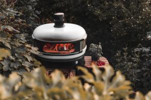 a grill with a fire inside of it at Boutique Beach Retreat in Westward Ho +23 photos