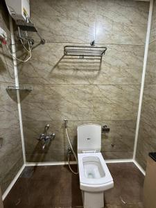 Koupelna v ubytování HOTEL ATITHI INN