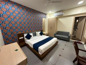 Postel nebo postele na pokoji v ubytování HOTEL ATITHI INN