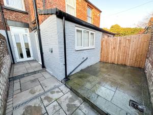 an empty patio in front of a house at Modern & Spacious, Central Location, FREE PARKING, FREE WIFI in Liverpool