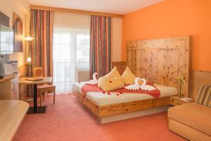 Posteľ alebo postele v izbe v ubytovaní Thermenhotel PuchasPLUS Stegersbach