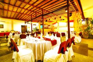 A restaurant or other place to eat at Nirmala Hotel & Convention Centre
