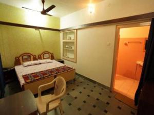 Voodi või voodid majutusasutuse Hotel Om Pushkar toas