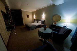 Postel nebo postele na pokoji v ubytování Royal Sapphire Hotel