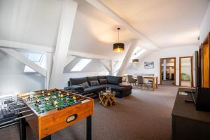 a living room with a foos ball on a table at Vila Kollár Vysoké Tatry in Smokovce