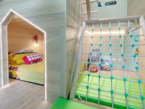 Letto o letti in una camera di Wind Natural Parent-child Inn
