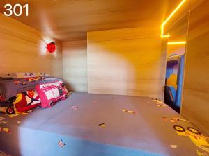 Letto o letti in una camera di Wind Natural Parent-child Inn