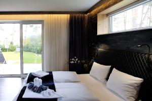 Postel nebo postele na pokoji v ubytování Privat & Boutique Hotel Plauer See